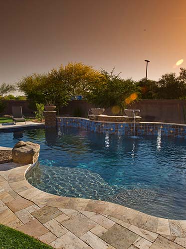 paver pool deck in the evening