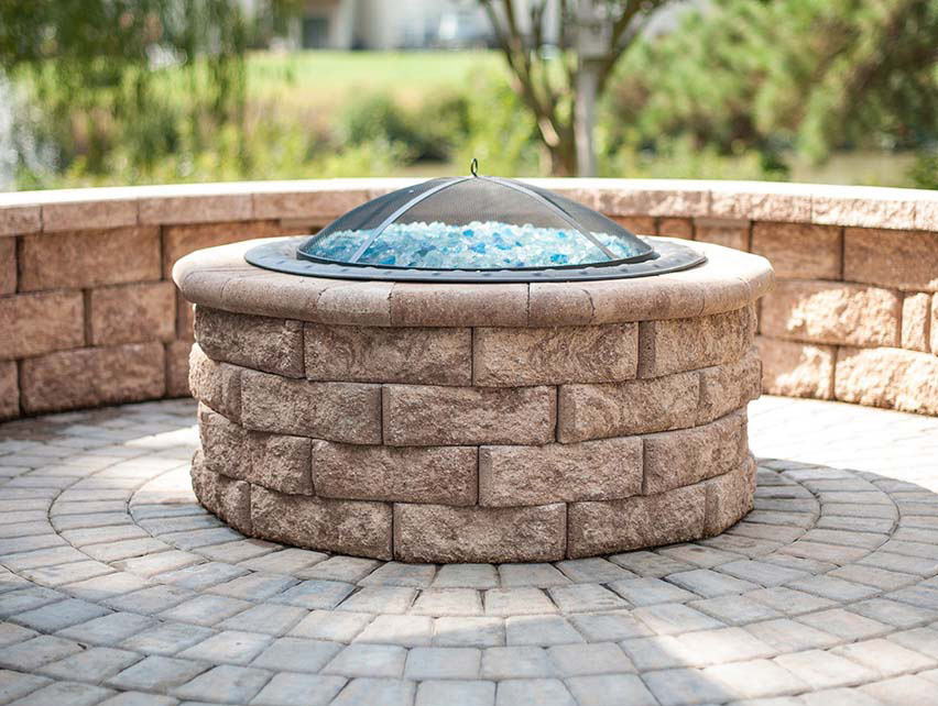 tan and blue fire pit made from stone bricks