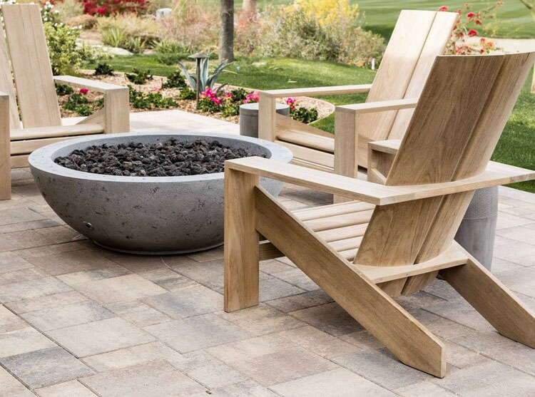 patio pavers with fire pit and wooden chairs