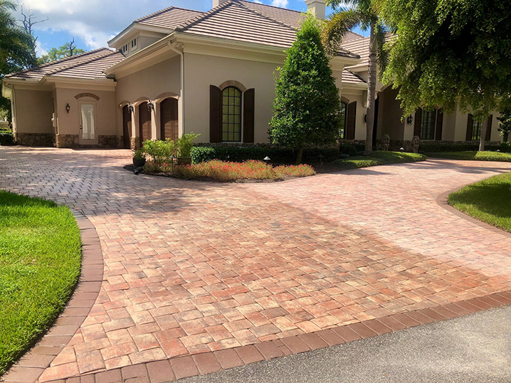 driver brick pavers that are in the process of being sealed