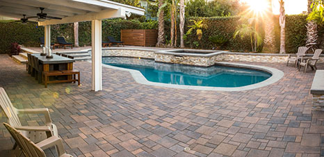 pool deck with warm color brick pavers
